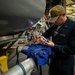 USS Sioux City Sailor Conducts Maintenance on MOBIs While in Port