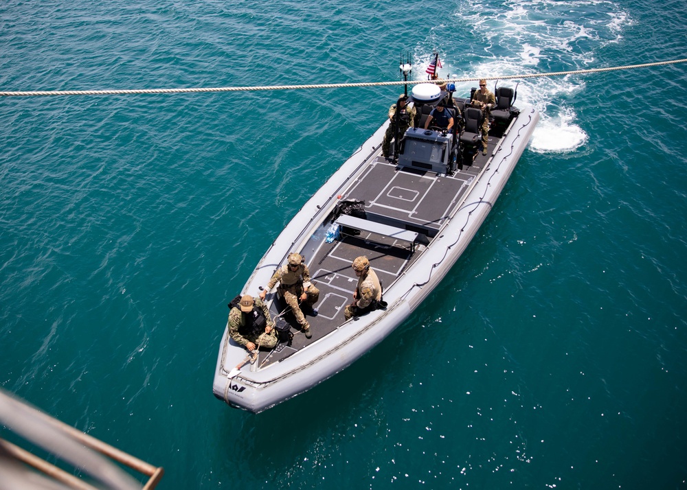 Coast Guardsmen and Sailors Conduct Rigid-Hull Inflatable Boat Exercises