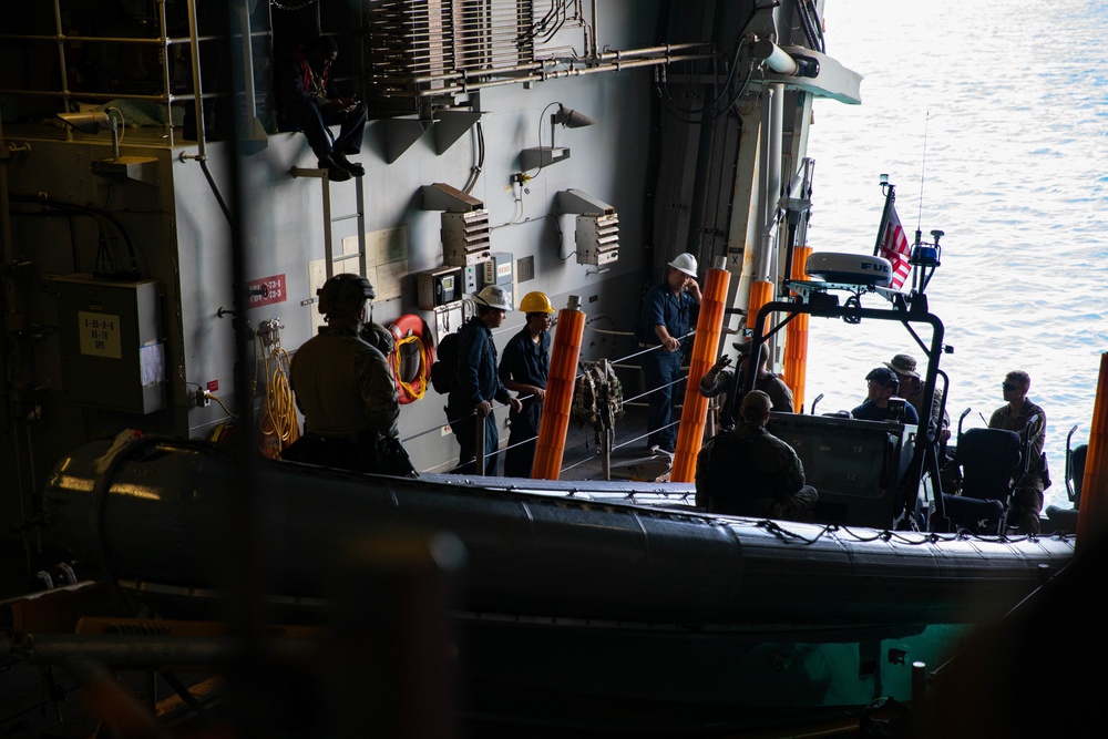 Coast Guardsmen and Sailors Conduct Rigid-Hull Inflatable Boat Exercises