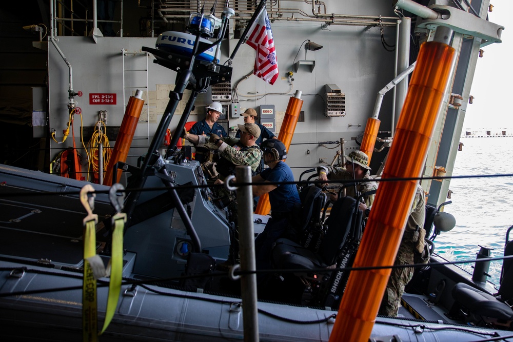 Coast Guardsmen and Sailors Conduct Rigid-Hull Inflatable Boat Exercises