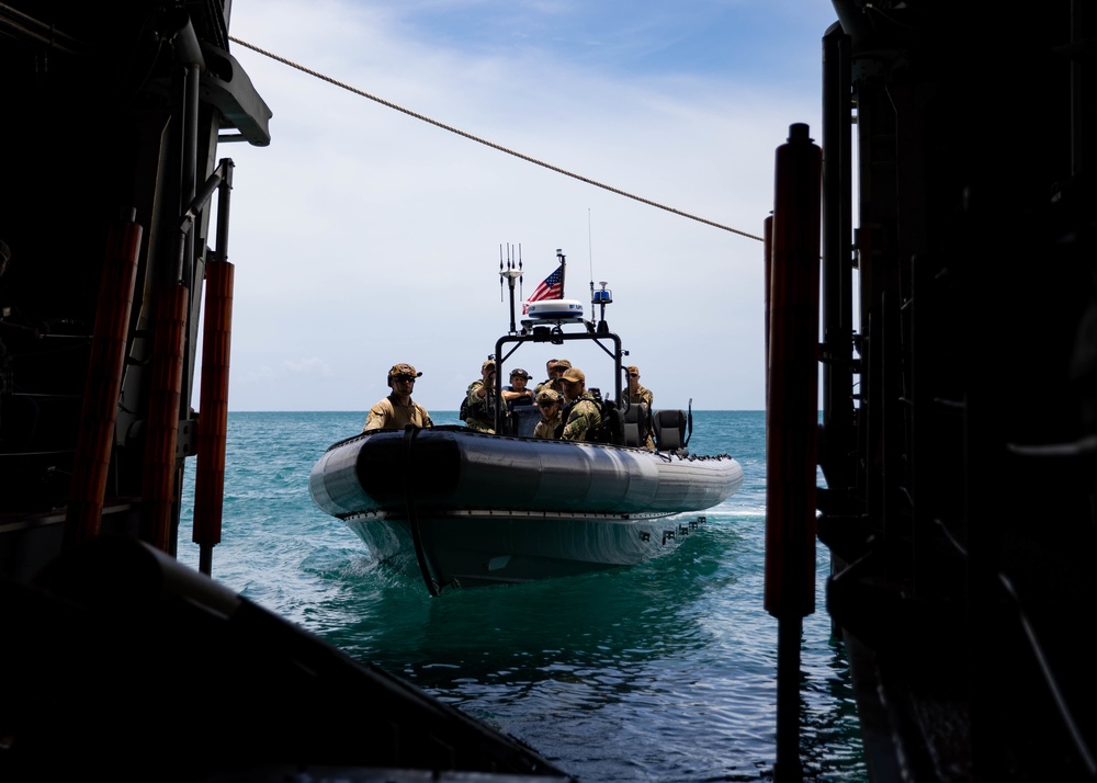 Coast Guardsmen and Sailors Conduct Rigid-Hull Inflatable Boat Exercises