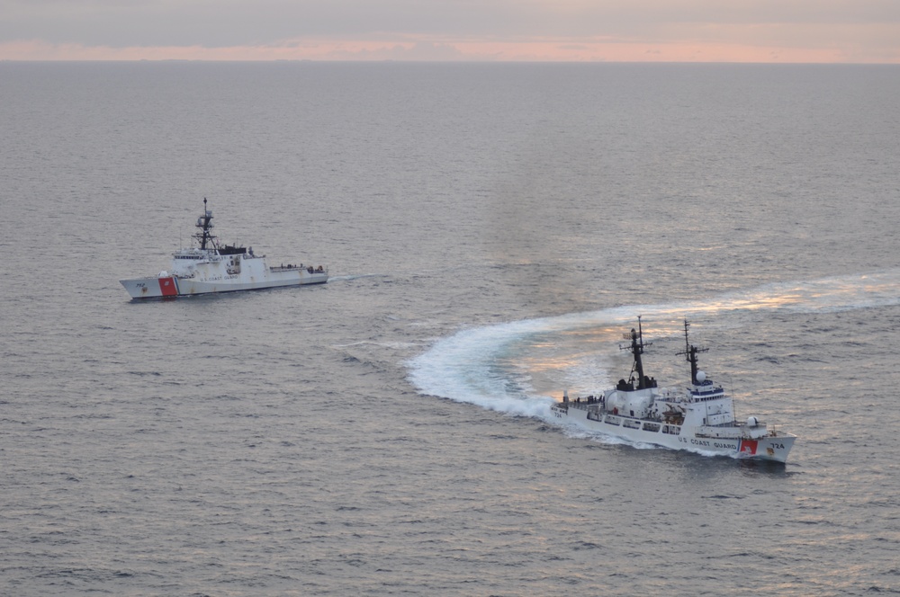 The Coast Guard Cutter Douglas Munro turns to port as she is relieved by Coast Guard Cutter Stratton in the Bering Sea