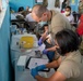 U.S. military medical professionals provide emergency care during RS-21