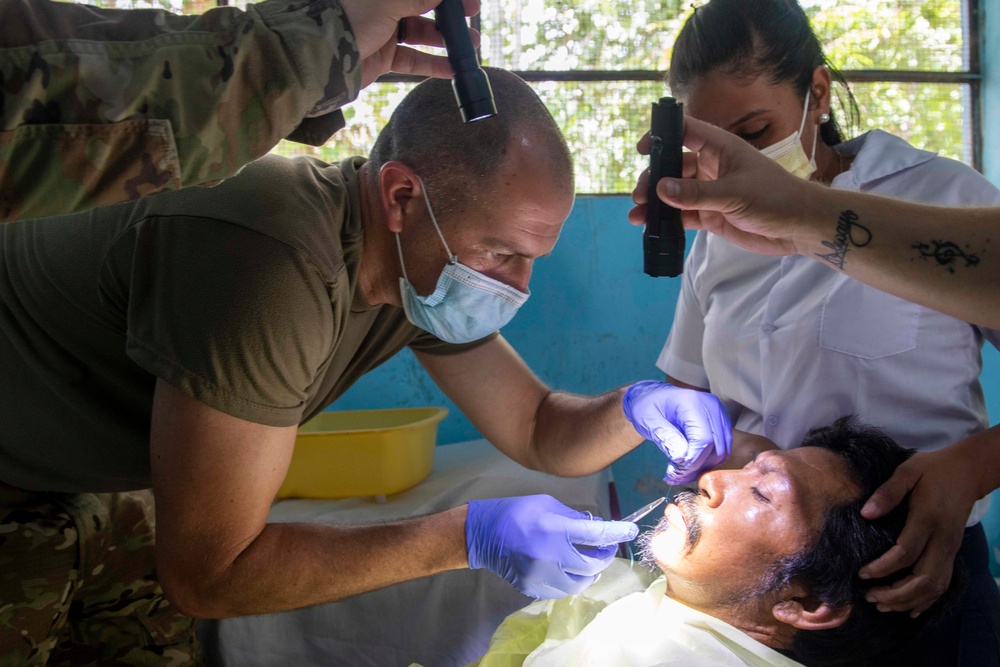 U.S. military medical professionals provide emergency care during RS-21