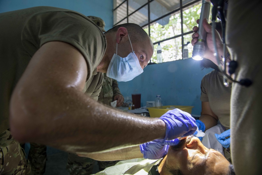 U.S. military medical professionals provide emergency care during RS-21