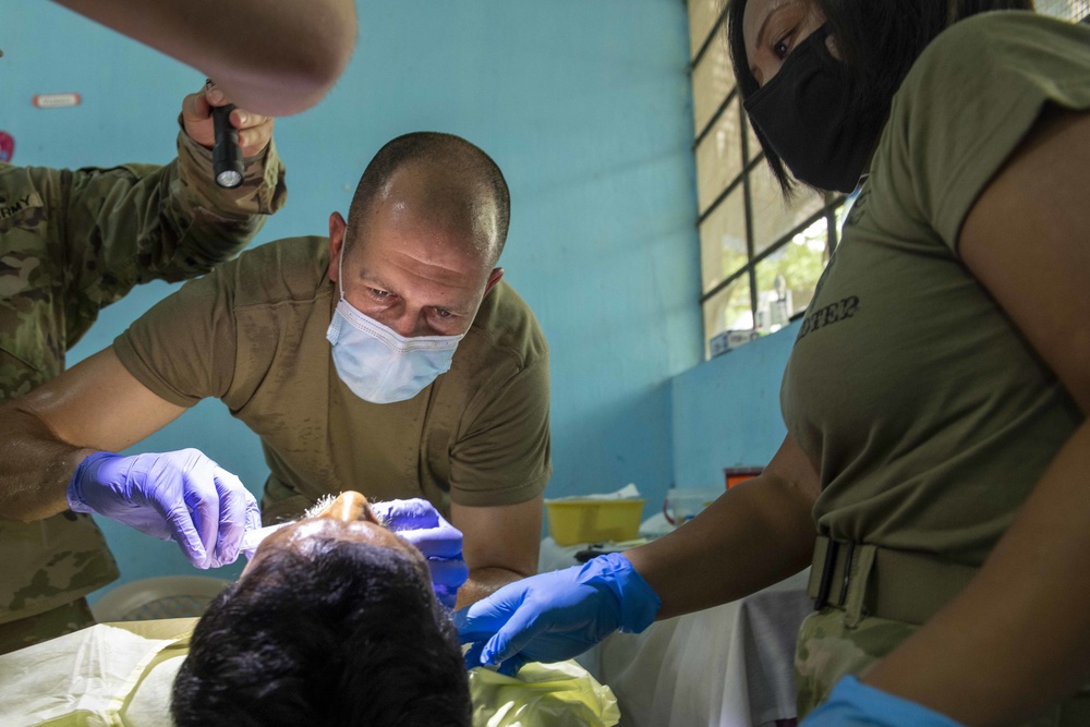 U.S. military medical professionals provide emergency care during RS-21