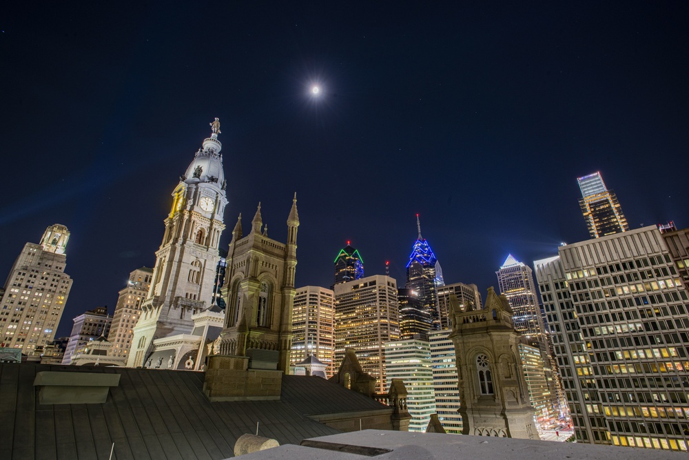 Philadelphia lights city blue, green in recognition of Pa. Guard, others for support to mass vaccine sites