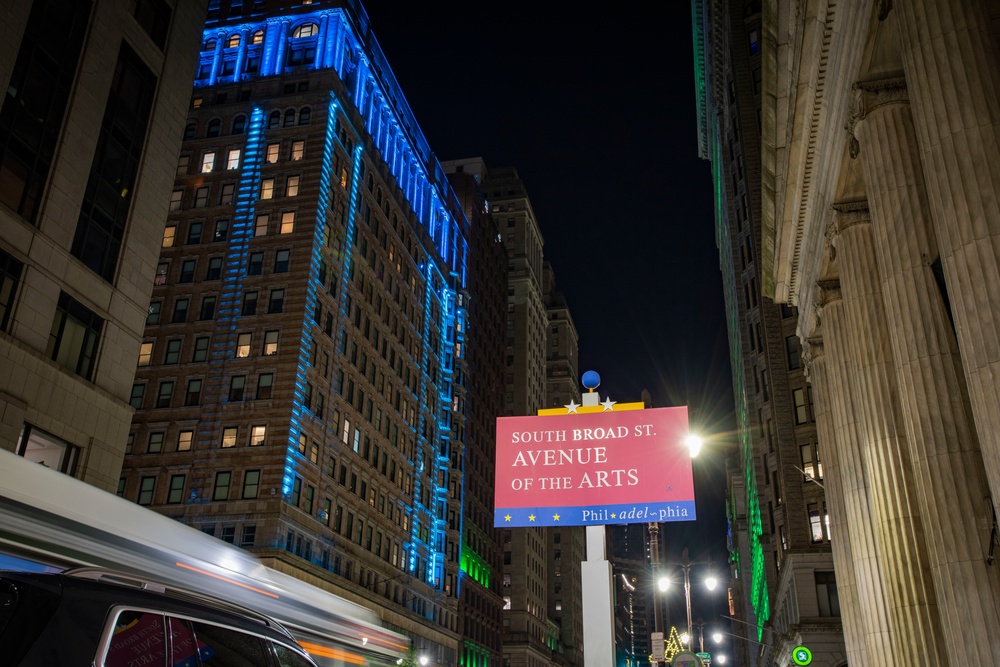 Philadelphia lights city blue, green in recognition of Pa. Guard, others for support to mass vaccine sites