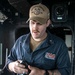 Hospital Corpsman 3rd Class Malcolm Carey conducts a water safety test in the pilot house