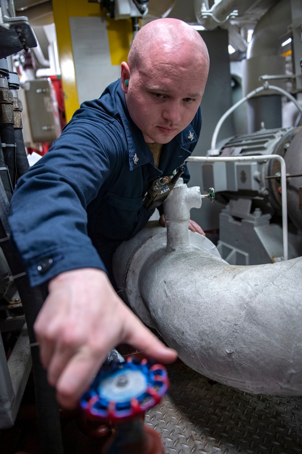 Machinist Mate 3rd Class Storm Jackson opens water valves to test bromide levels