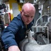 Machinist Mate 3rd Class Storm Jackson opens water valves to test bromide levels