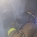 Sailor uses a RAMFAN to desmoke a space during a firefighting drill