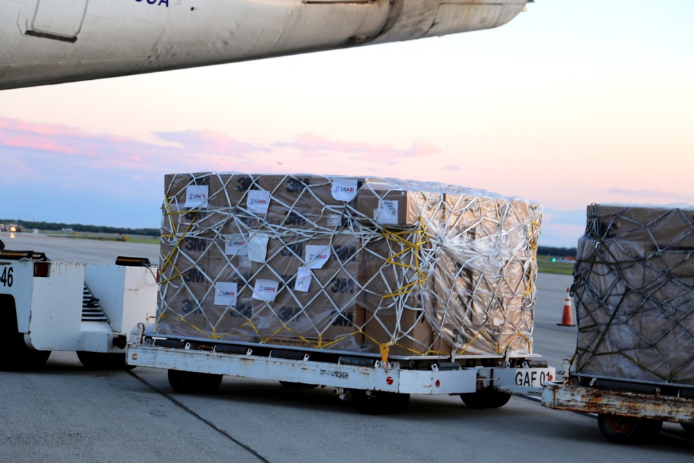 Supplies the U.S. government, through the U.S. Agency for International Development, donated to India, are transported onto a waiting National Airlines plane on April 30, 2021.