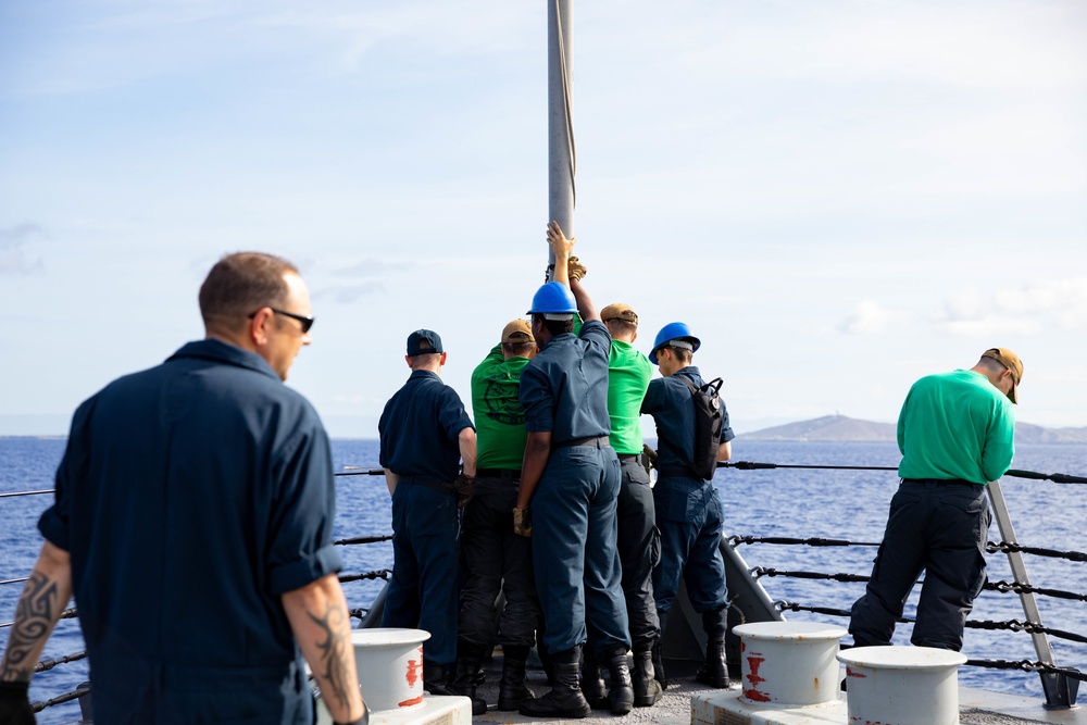 USS Sioux City and HSC 22 Sailors Raise the Jackstaff as the Ship Pulls Into Port at Naval Station Guantanamo Bay
