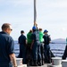 USS Sioux City and HSC 22 Sailors Raise the Jackstaff as the Ship Pulls Into Port at Naval Station Guantanamo Bay
