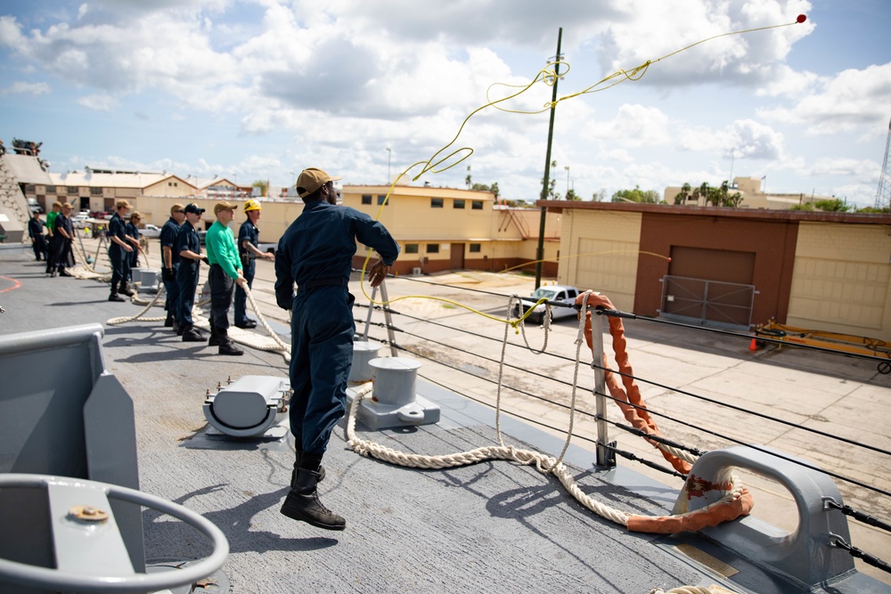 USS Sioux City and HSC 22 Sailors Throw Over Lines as the Ship Pulls Into Port at Naval Station Guantanamo Bay, Cuba
