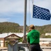 HSC 22 Sailor Raises the Union Jack as USS Sioux City Pulls Into Port at Naval Station Guantanamo Bay, Cuba