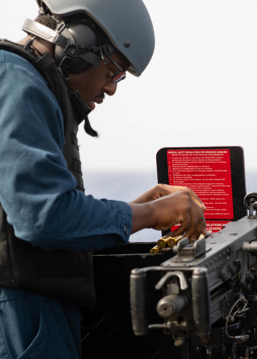 USS Sioux City Sailor Reloads a .50-Caliber Machine Gun for a Requalification Shoot