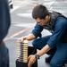 USS Sioux City Sailor Prepares to Participate in a .50-Caliber Machine Gun Qualification Shoot
