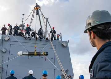USS Michael Murphy Sailors Onload a Torpedo