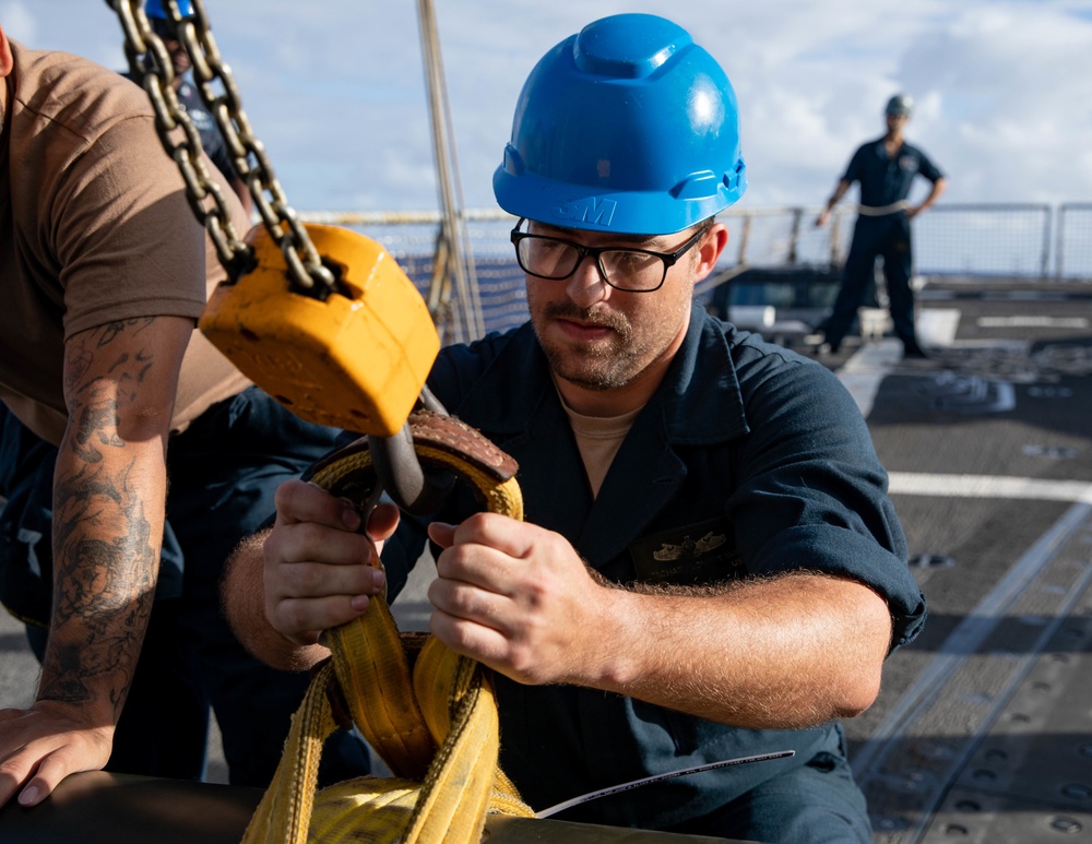 USS Michael Murphy Sailors Onload a Torpedo
