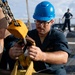 USS Michael Murphy Sailors Onload a Torpedo