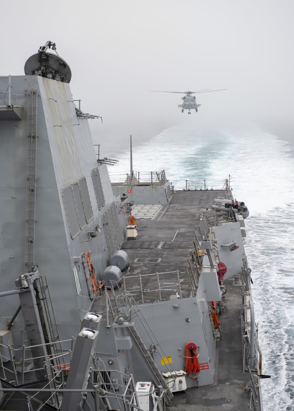 MH-60R Seahawk, assigned to the “Warlords” of Helicopter Maritime Strike Squadron (HSM-51), conducts a landing maneuver