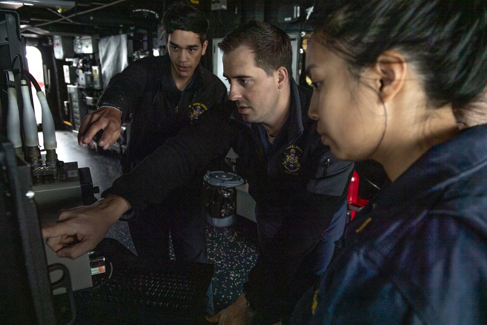 Sailors track surface contacts in the pilot house