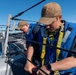 USS O’Kane Sailors perform maintenance on life lines
