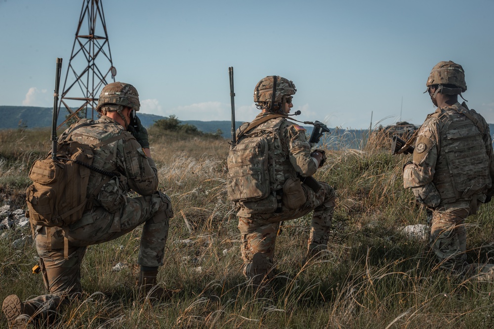 2CR Soldiers conduct a forward assault on a target during Saber Guardian 21