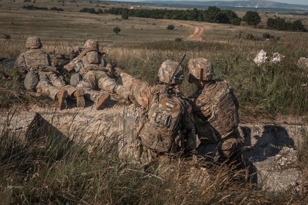 2CR Soldiers conduct support by fire on a target during Saber Guardian 21