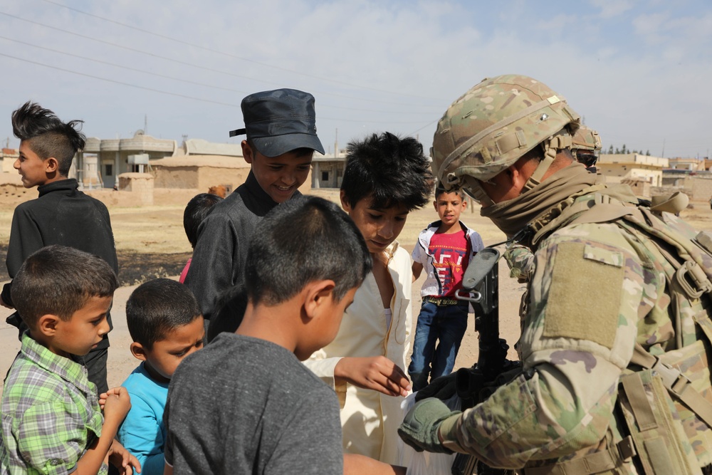 Local children react to U.S Military presence