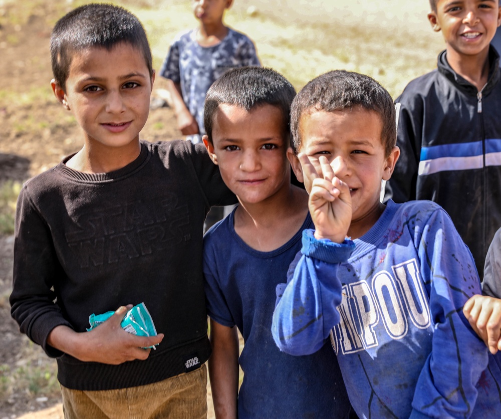 Local children react to U.S Military presence