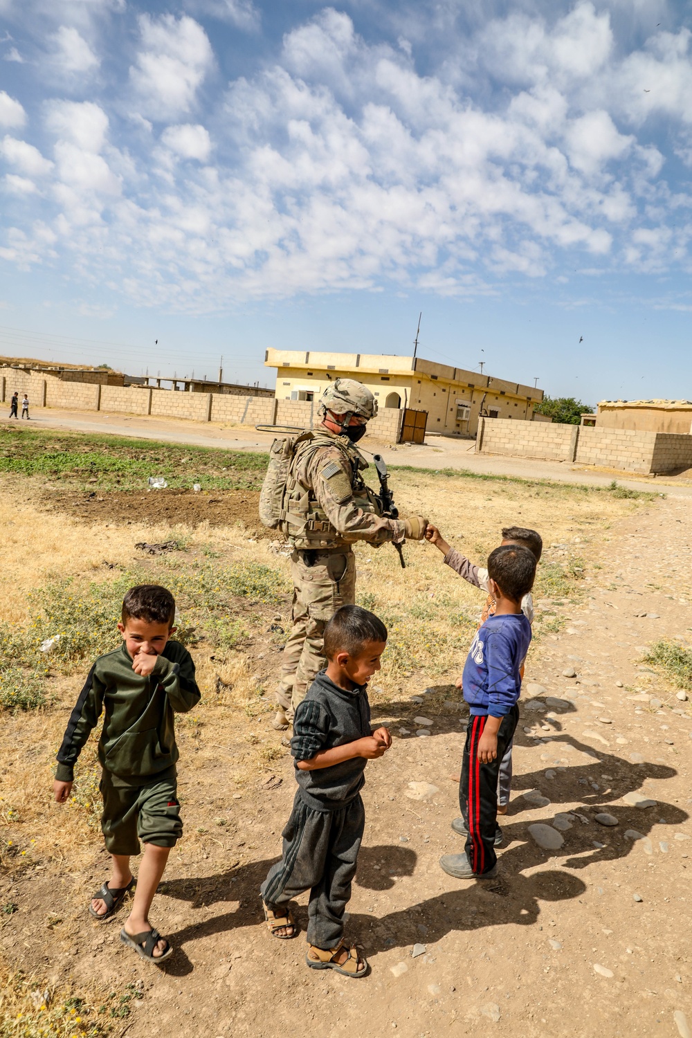 Local children react to U.S Military presence