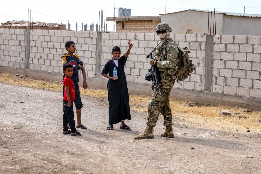 Local children react to U.S Military presence