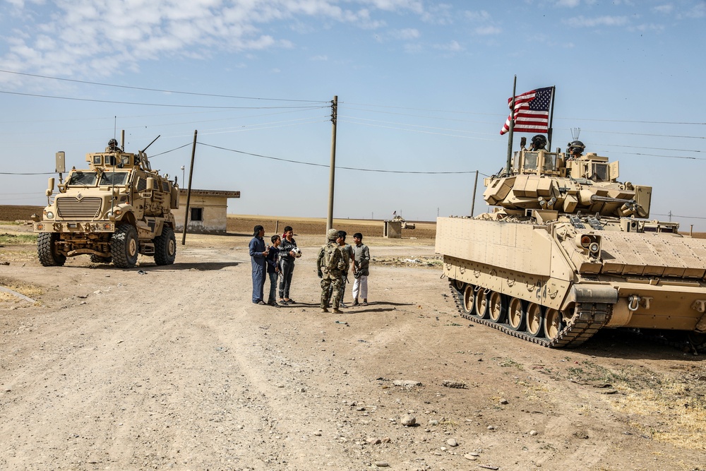 Local children react to U.S Military presence