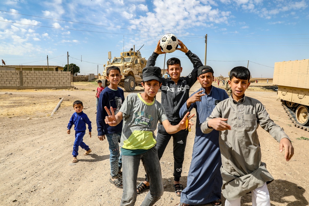 Local children react to U.S Military presence