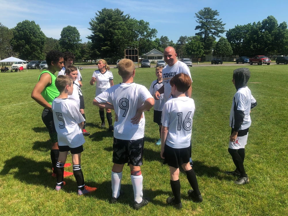 HHC Soldiers share love of soccer with Tomah youth