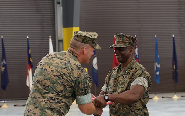Lt. Col. Fred Glencamp receives the Meritorious Service Medal from Col. Kipp A. Wahlgren, commanding officer, MFSC
