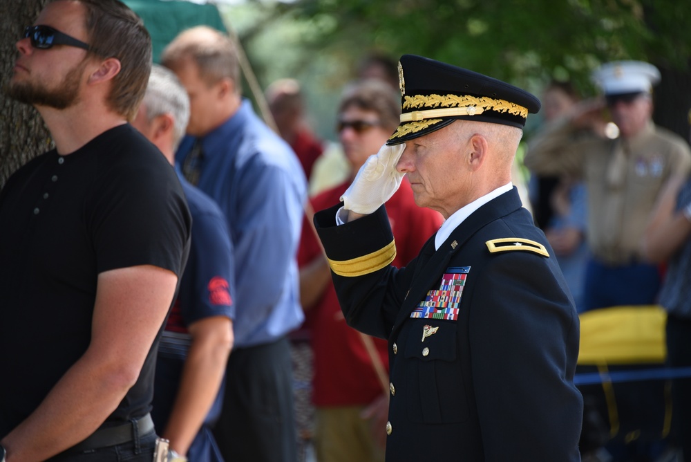 Brig. Gen. Stephen Osborn salutes Cpl. Eldert J. Beek