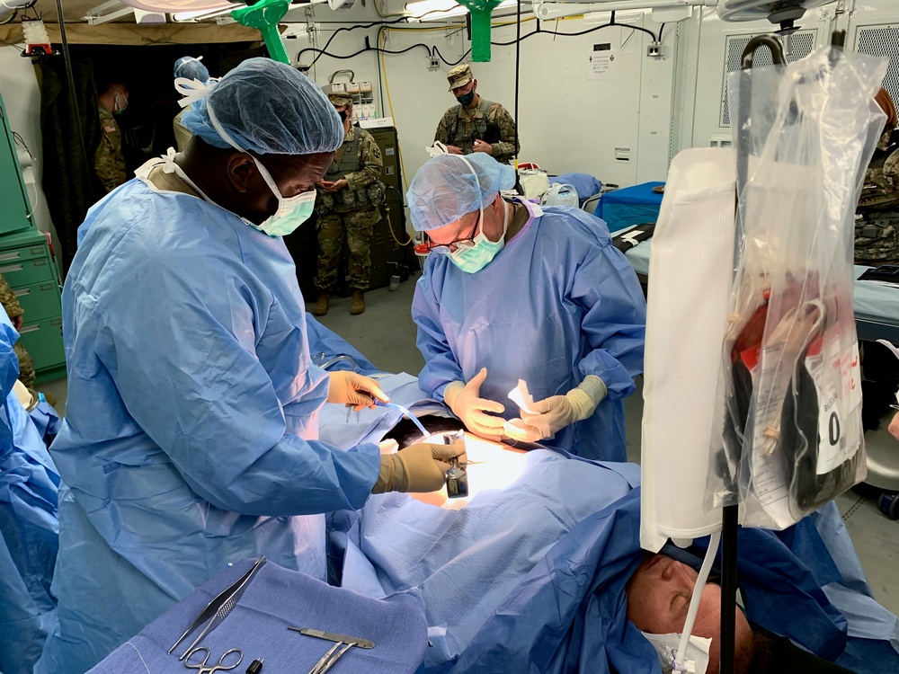 U.S. Army Reserve medical Soldiers operate on a simulated casualty during Global Medic