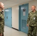 U.S. Navy Master Chief Petty Officer Chris Chelberg, right, commander, Naval Air Force Atlantic’s force master chief, speaks to a sailor assigned to the aircraft carrier USS John C. Stennis (CVN 74) about the ship’s Refueling and Complex Overhaul,