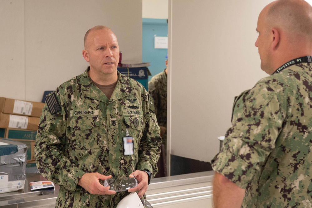 U.S. Navy Master Chief Petty Officer Chris Chelberg, left, commander, Naval Air Force Atlantic’s force master chief speaks to a sailor assigned to the aircraft carrier USS John C. Stennis (CVN 74) about the ship’s Refueling and Complex Overhaul.