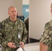 U.S. Navy Master Chief Petty Officer Chris Chelberg, left, commander, Naval Air Force Atlantic’s force master chief speaks to a sailor assigned to the aircraft carrier USS John C. Stennis (CVN 74) about the ship’s Refueling and Complex Overhaul.