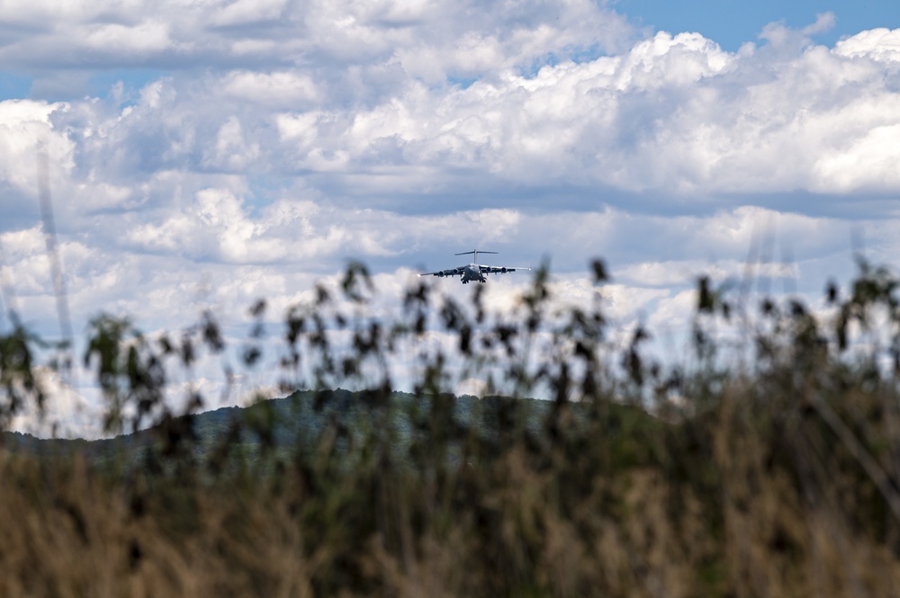 A West Virginia ANG C-17 flies over the landing zone at Young Air Assault Strip