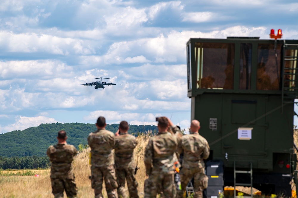 A West Virginia ANG C-17 flies over the landing zone at Young Air Assault Strip