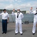 Two Sailors and one Soldier become new citizens of the U.S. during a naturalization ceremony aboard USS Milius stationed at CFAY