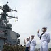 Two Sailors and one Soldier become new citizens of the U.S. during a naturalization ceremony aboard USS Milius stationed at CFAY