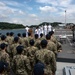 Two Sailors and one Soldier become new citizens of the U.S. during a naturalization ceremony aboard USS Milius stationed at CFAY
