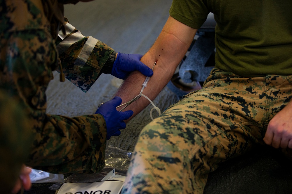 US Marines and Sailors conduct a live fresh old blood transfusion demonstration